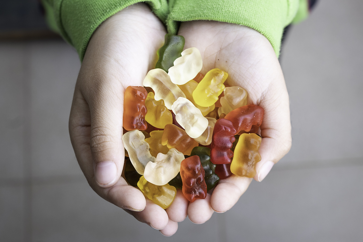 Baubles, child's hands with sweets