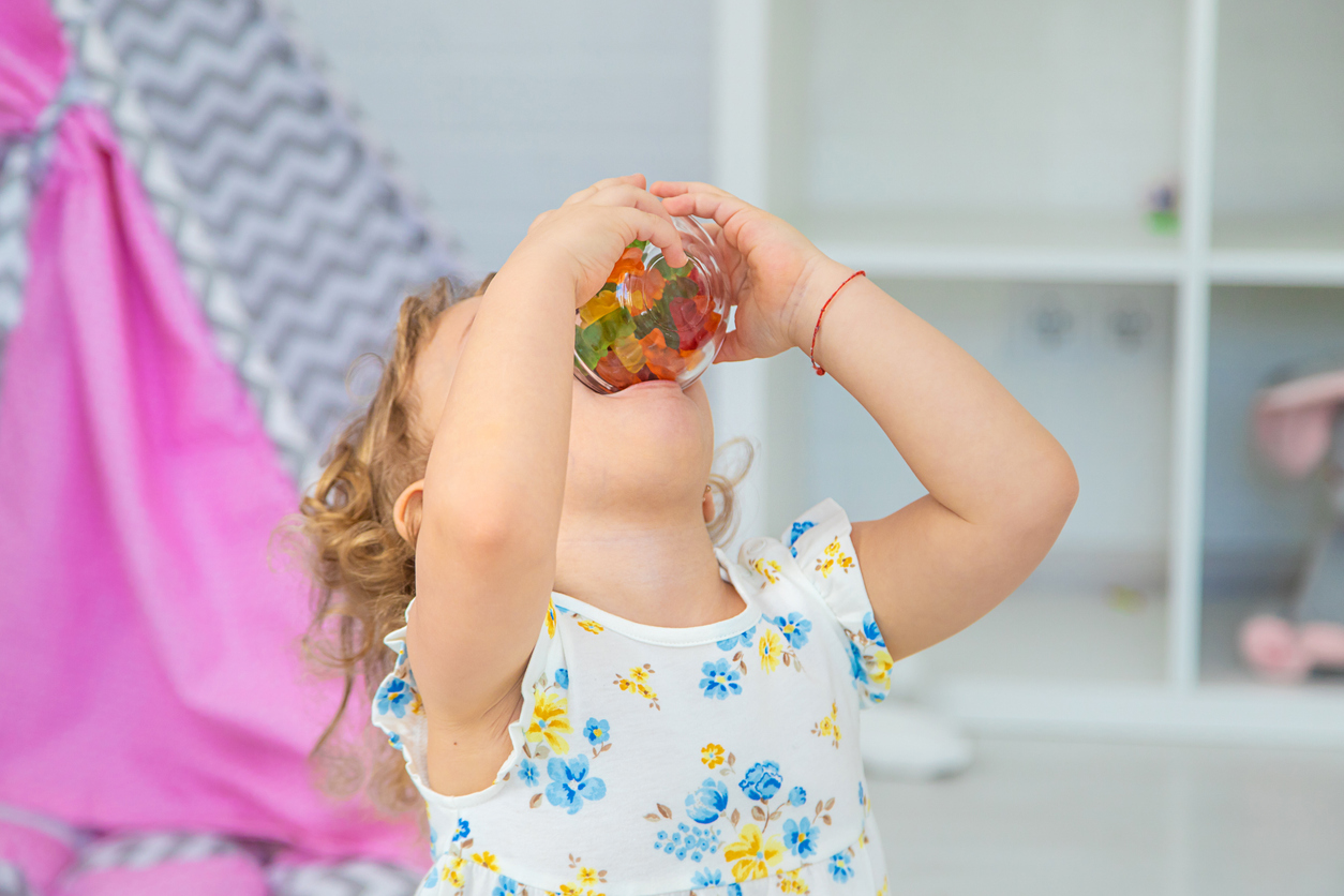 The child eats jelly candies. Selective focus. Kid,